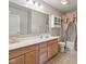 Bathroom with double vanity, tile floor, and decorative pink accents at 6681 Keepsake Dr, Whitestown, IN 46075