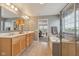 Spacious bathroom features double sinks, large vanity, bathtub, and glass-enclosed shower at 6681 Keepsake Dr, Whitestown, IN 46075
