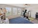 Bright workout space with exercise equipment, natural light from the large sunny windows at 6681 Keepsake Dr, Whitestown, IN 46075