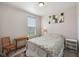 Cozy bedroom with a window for natural light, carpet floors, and neutral walls at 6681 Keepsake Dr, Whitestown, IN 46075