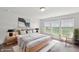 Serene bedroom with large windows and a cozy reading nook by the window at 6681 Keepsake Dr, Whitestown, IN 46075