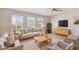 Spacious living room with plenty of seating, bright windows, and modern decor at 6681 Keepsake Dr, Whitestown, IN 46075
