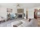 Comfortable living room featuring a stone fireplace, neutral decor, and modern furnishings at 6681 Keepsake Dr, Whitestown, IN 46075