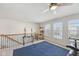 Spacious loft with ceiling fan, exercise equipment, and great natural light from windows at 6681 Keepsake Dr, Whitestown, IN 46075