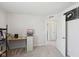 Bright office area with desk, shelving units and view into hallway at 6681 Keepsake Dr, Whitestown, IN 46075