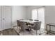 Dining room featuring a modern table with six chairs and natural light at 6953 Equality Blvd, Carmel, IN 46033