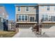 Townhome features a two-car garage, private balcony, and neutral exterior at 6953 Equality Blvd, Carmel, IN 46033