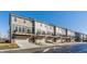 Row of newly constructed townhomes features attached garages and balcony spaces at 6953 Equality Blvd, Carmel, IN 46033