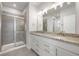 Elegant bathroom featuring a double vanity with granite countertop and a glass-enclosed shower at 798 James William Ln, Westfield, IN 46074