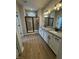 Modern bathroom featuring a double vanity with granite counters, a glass-enclosed shower, and stylish lighting fixtures at 798 James William Ln, Westfield, IN 46074