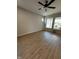 Bright bedroom featuring wood-look floors, a ceiling fan, recessed lighting, and large windows offering a pleasant view at 798 James William Ln, Westfield, IN 46074