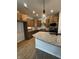 Well-equipped kitchen showcasing granite countertops, wood cabinets, stainless steel appliances, and modern pendant lighting at 798 James William Ln, Westfield, IN 46074