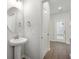 Stylish powder room featuring a pedestal sink and modern fixtures, perfect for guests' convenience at 798 James William Ln, Westfield, IN 46074