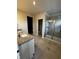 Bathroom with dual granite vanity, a walk-in shower, and tile flooring at 799 Rose Garden Way, Westfield, IN 46074