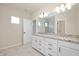 Bathroom featuring double sinks with granite countertops, white cabinets and a tiled floor at 799 Rose Garden Way, Westfield, IN 46074