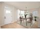 An elegant dining room with a table set for four, complete with decor and window views at 799 Rose Garden Way, Westfield, IN 46074