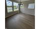Sunlit dining room with hardwood floors, modern chandelier, and large windows at 799 Rose Garden Way, Westfield, IN 46074