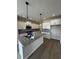 Modern kitchen with granite counters, stainless steel appliances, and white cabinets at 799 Rose Garden Way, Westfield, IN 46074