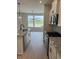 Modern kitchen with granite countertops, stainless steel appliances, and a view of the front yard at 799 Rose Garden Way, Westfield, IN 46074