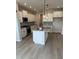 Well-equipped kitchen with granite counters, stainless appliances, and a center island with a sink at 799 Rose Garden Way, Westfield, IN 46074