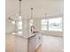 Open-concept kitchen island featuring stainless steel appliances at 799 Rose Garden Way, Westfield, IN 46074