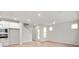 View of living room with light hardwood floors, white walls, and access to stairs at 799 Rose Garden Way, Westfield, IN 46074