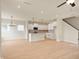 Open-concept living room and kitchen space featuring hardwood floors and recessed lighting at 799 Rose Garden Way, Westfield, IN 46074