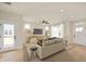 Comfortable living room featuring a sofa, media console, and modern decor at 799 Rose Garden Way, Westfield, IN 46074