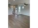 Spacious living room with luxury vinyl plank flooring, ceiling fan, and ample natural light at 799 Rose Garden Way, Westfield, IN 46074