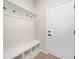 Functional mudroom with storage bench and coat hooks by the entrance at 799 Rose Garden Way, Westfield, IN 46074