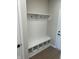 Functional mudroom with bench seating, storage cubbies, and coat hooks, ideal for organization at 799 Rose Garden Way, Westfield, IN 46074