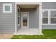 View of covered porch with gray horizontal siding and white trim at 799 Rose Garden Way, Westfield, IN 46074