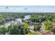Stunning aerial view of lakeside community featuring boat docks, swimming pool, and lush greenery at 8158 Shorewalk Dr # F, Indianapolis, IN 46236