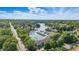 An aerial view shows the community's waterfront homes and tree-lined streets near the lake at 8158 Shorewalk Dr # F, Indianapolis, IN 46236
