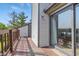 The beautiful balcony has wood floors and railings and offers access to a sliding glass door at 8158 Shorewalk Dr # F, Indianapolis, IN 46236