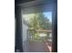 Outdoor balcony with a metal table and chairs overlooking trees at 8158 Shorewalk Dr # F, Indianapolis, IN 46236