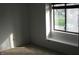 Sunlit bedroom featuring a window with a view and neutral carpet at 8158 Shorewalk Dr # F, Indianapolis, IN 46236