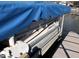 Pontoon boat with blue cover and registration numbers on the side at 8158 Shorewalk Dr # F, Indianapolis, IN 46236
