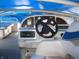 View of the boat's helm featuring a steering wheel, dashboard, and seating at 8158 Shorewalk Dr # F, Indianapolis, IN 46236