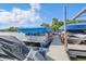 The docks feature covered boats and a boardwalk to access them for lakeside fun at 8158 Shorewalk Dr # F, Indianapolis, IN 46236