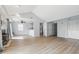 Spacious living room with a fireplace, ceiling fan, and easy access to the kitchen and hallway at 8158 Shorewalk Dr # F, Indianapolis, IN 46236