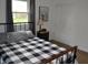 A bedroom with a nice view through the window, and closet storage at 838 Highland Dr, Whiteland, IN 46184