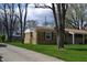 Brick ranch-style home featuring a well-maintained lawn and mature trees at 838 Highland Dr, Whiteland, IN 46184