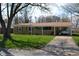 Charming ranch-style home with a quaint front yard, brick facade and a covered carport for convenient parking at 838 Highland Dr, Whiteland, IN 46184