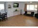 Spacious living area with light wood floors and view of the adjacent dining space at 838 Highland Dr, Whiteland, IN 46184
