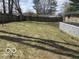 Spacious backyard featuring a wooden fence and mature trees at 8625 Edith St, Martinsville, IN 46151