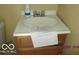 Bathroom vanity with white sink and wooden cabinet at 8625 Edith St, Martinsville, IN 46151