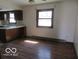 Bright eat-in kitchen area features wooden cabinets and a large window at 8625 Edith St, Martinsville, IN 46151