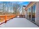 Relax on this expansive snow-covered deck, accessible through sliding glass doors for year-round enjoyment at 8717 Vintner Ct, Indianapolis, IN 46256