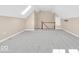 Upstairs bonus room featuring vaulted ceilings and staircase at 8717 Vintner Ct, Indianapolis, IN 46256